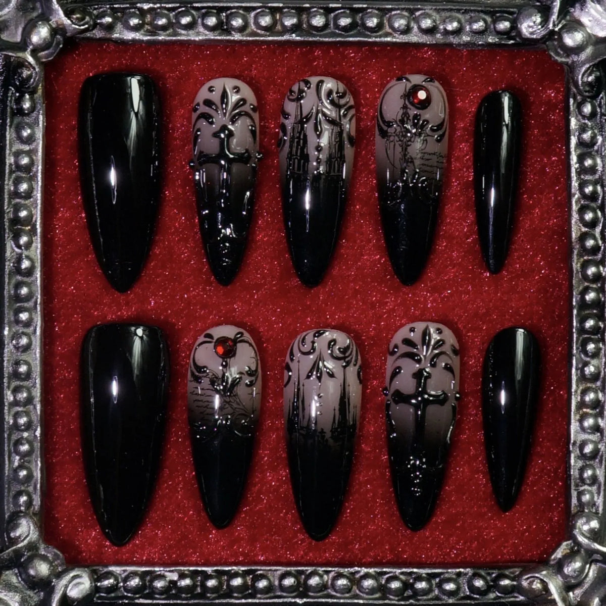 Manor of Shadows press-on nails: black and grey nails with raised filigree, haunted-mansion art, crosses and red gems