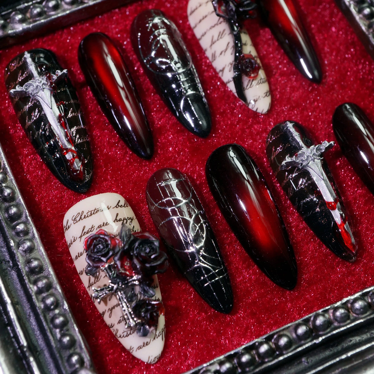 Gothic Requiem press-on nails, close-up of dagger and black rose details