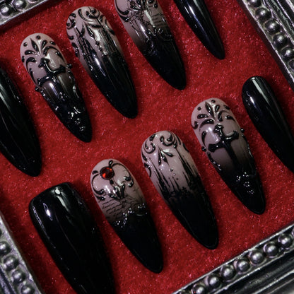 Manor of Shadows press-on nails, close-up of haunted-mansion art and filigree