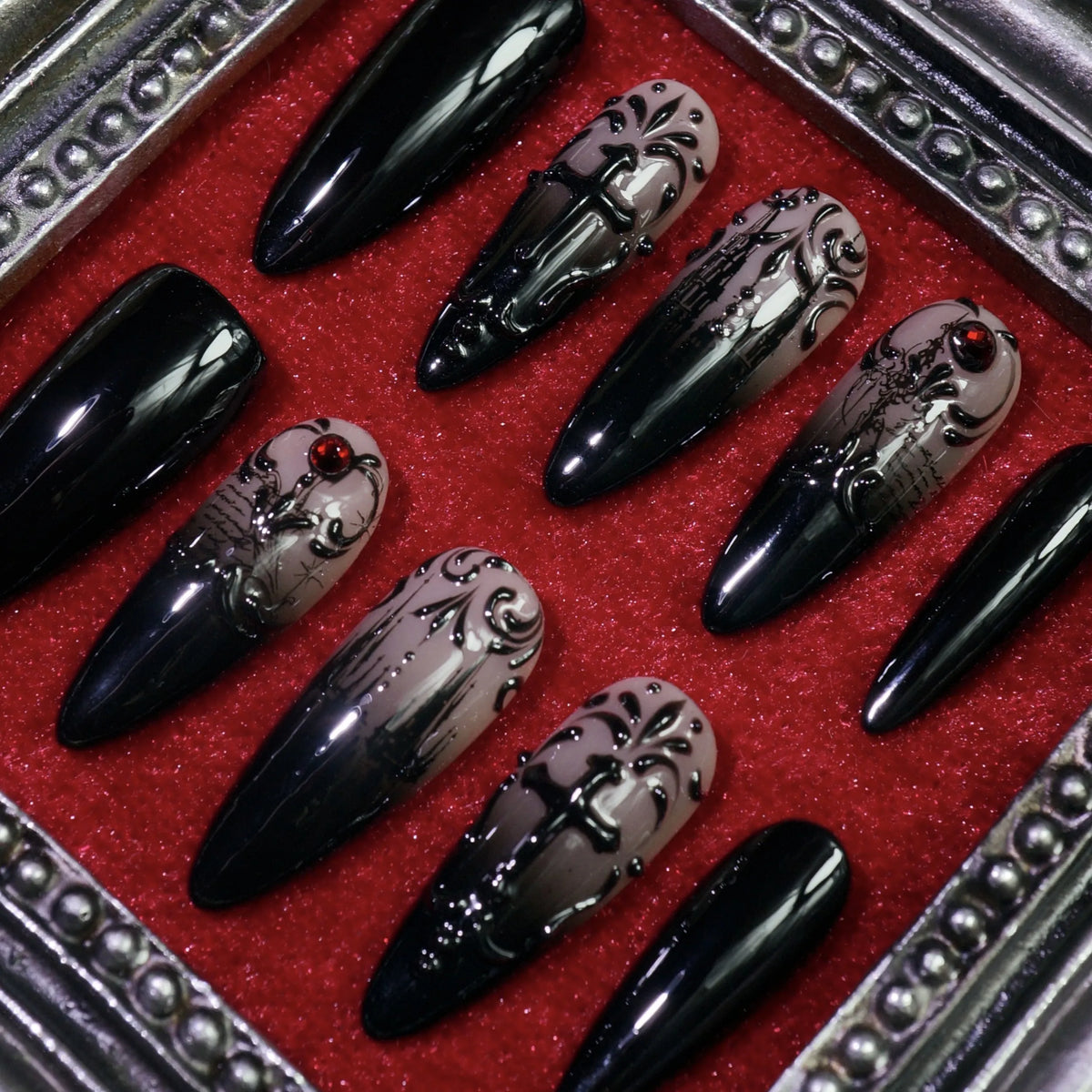 Manor of Shadows press-on nails, angled close-up of haunted-mansion art and filigree