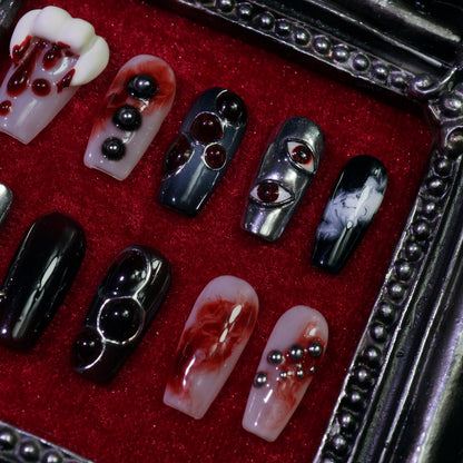 Vampire press-on nails, close-up of vampire fangs and blood drips