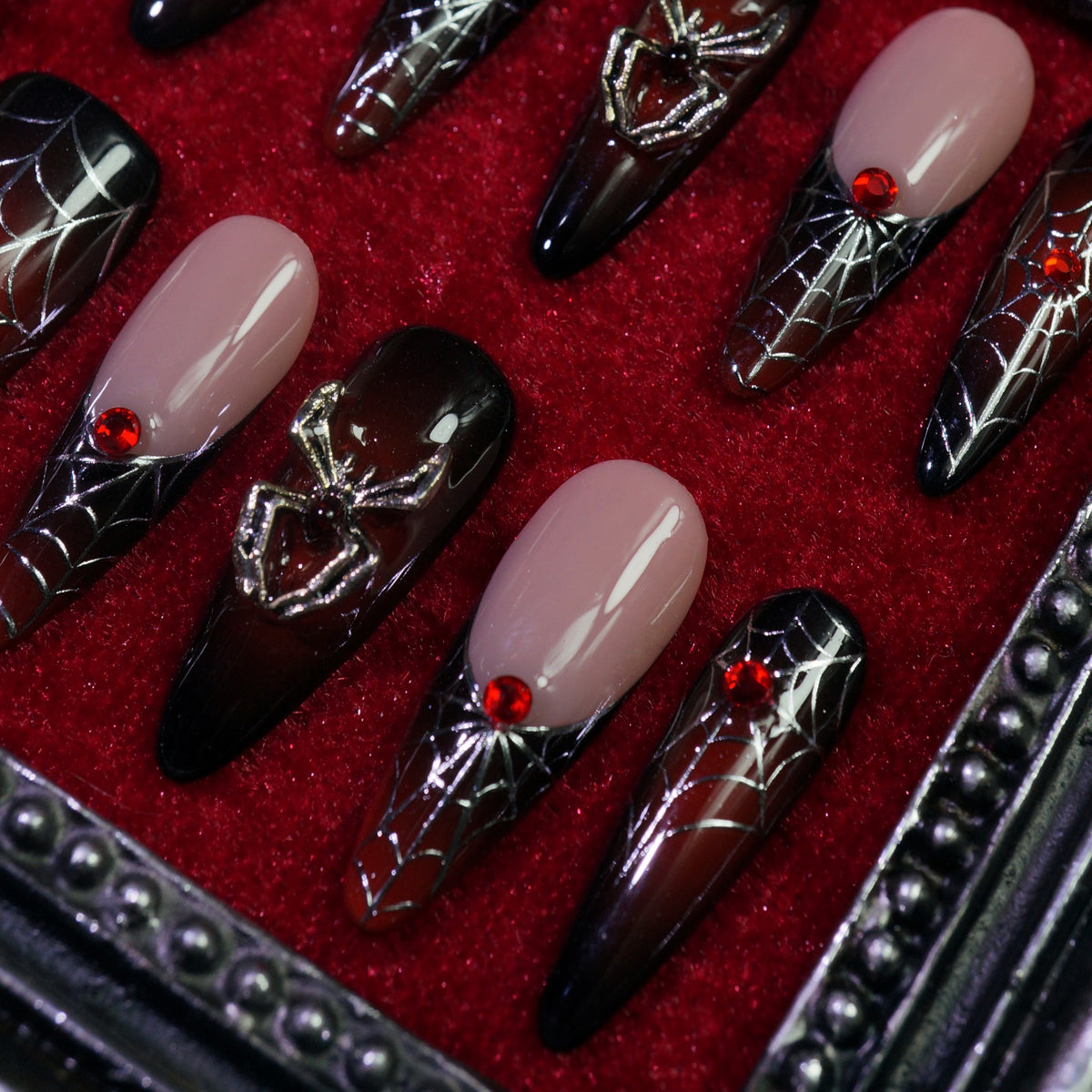 Crimson Web press-on nails, close-up of spider webs and 3D spiders