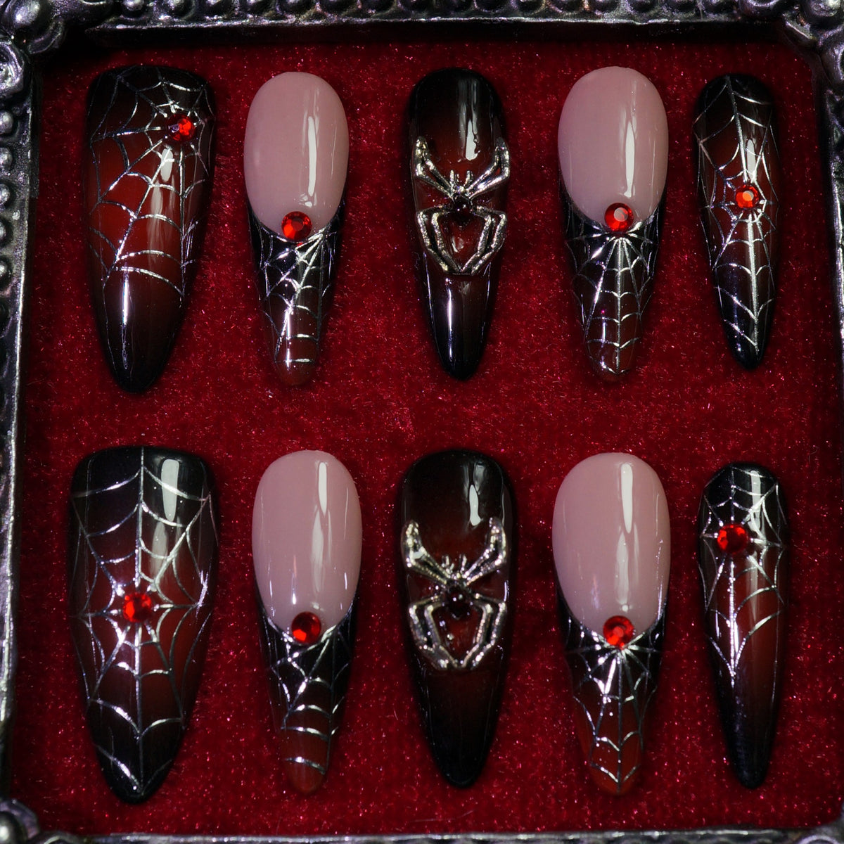 Crimson Web press-on nails, detail shot of spider webs and 3D spiders
