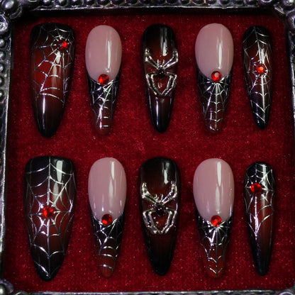 Crimson Web press-on nails, detail shot of spider webs and 3D spiders
