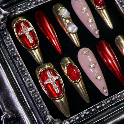 Crimson Regalia press-on nails, close-up of crosses, pearls and red gems