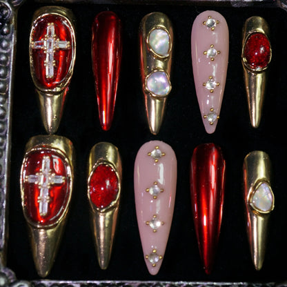 Crimson Regalia press-on nails, detail shot of crosses, pearls and red gems