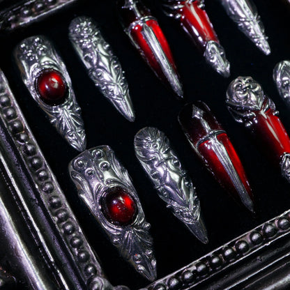 Blood Reliquary press-on nails, close-up of 3D silver armor and red gems