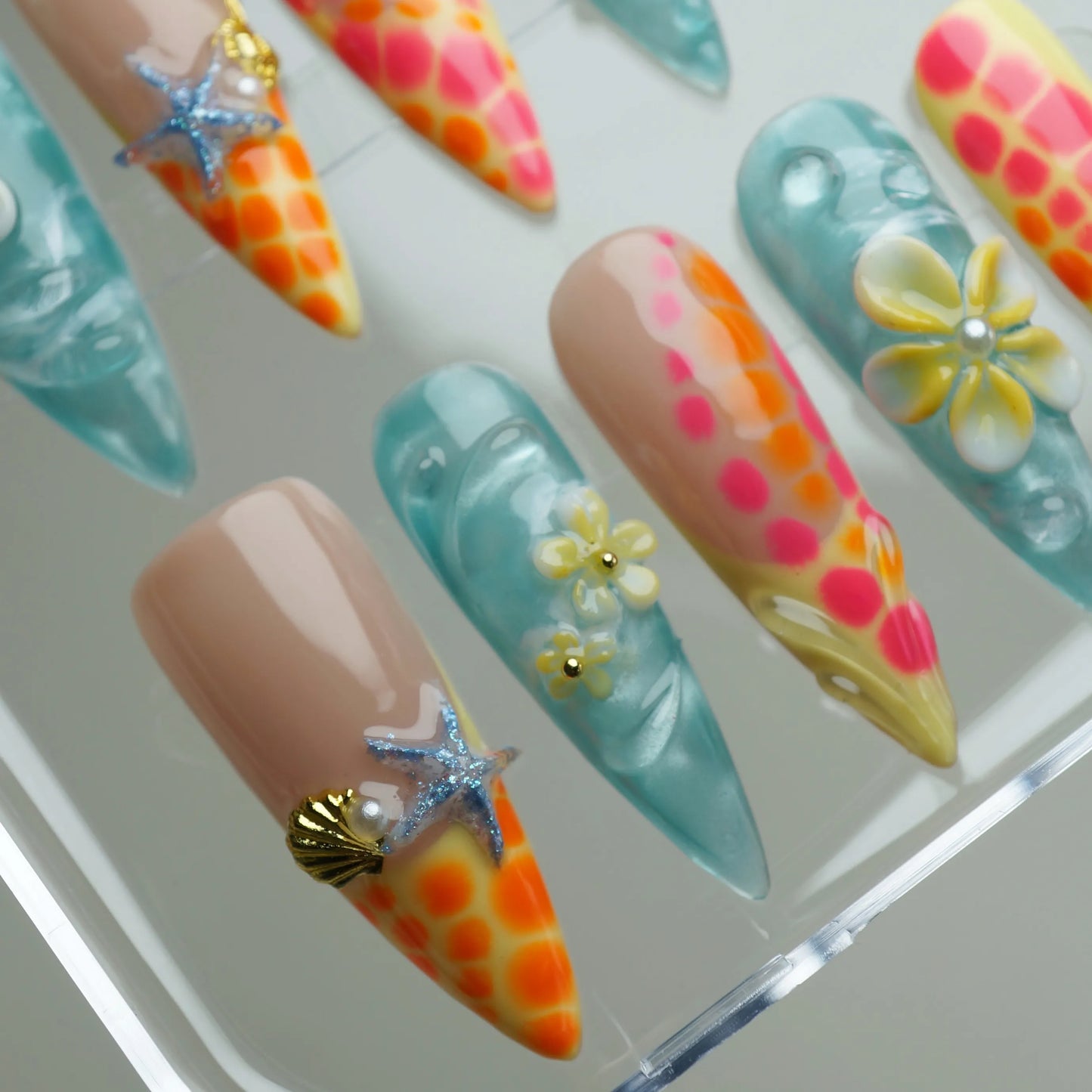 Neon Reef close-up detail showing vibrant neon orange coral and translucent ocean blue gel nail art – Donailsart