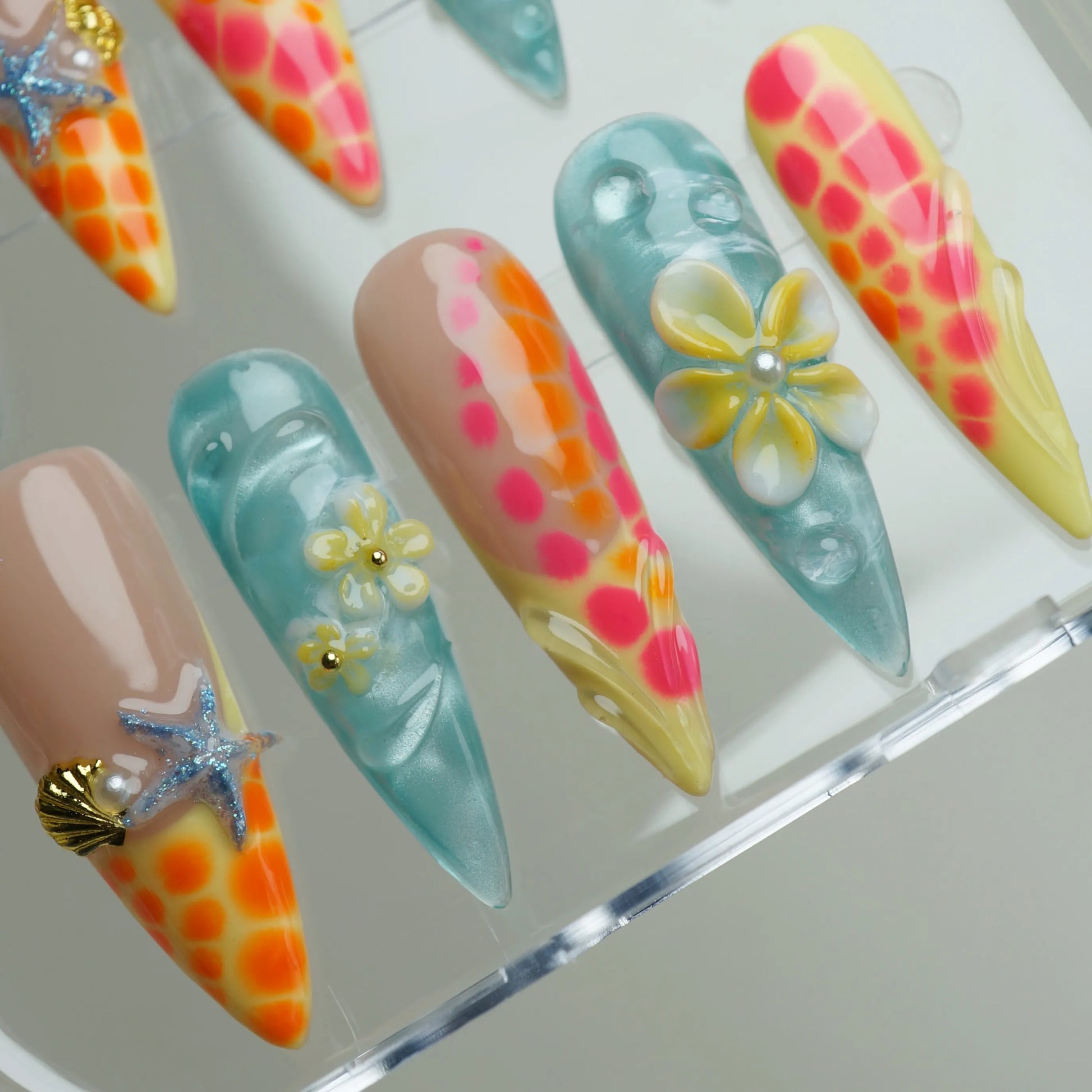 Neon Reef press-on nails side angle showing high-intensity tropical reef nail art in neon orange and ocean blue – Donailsart