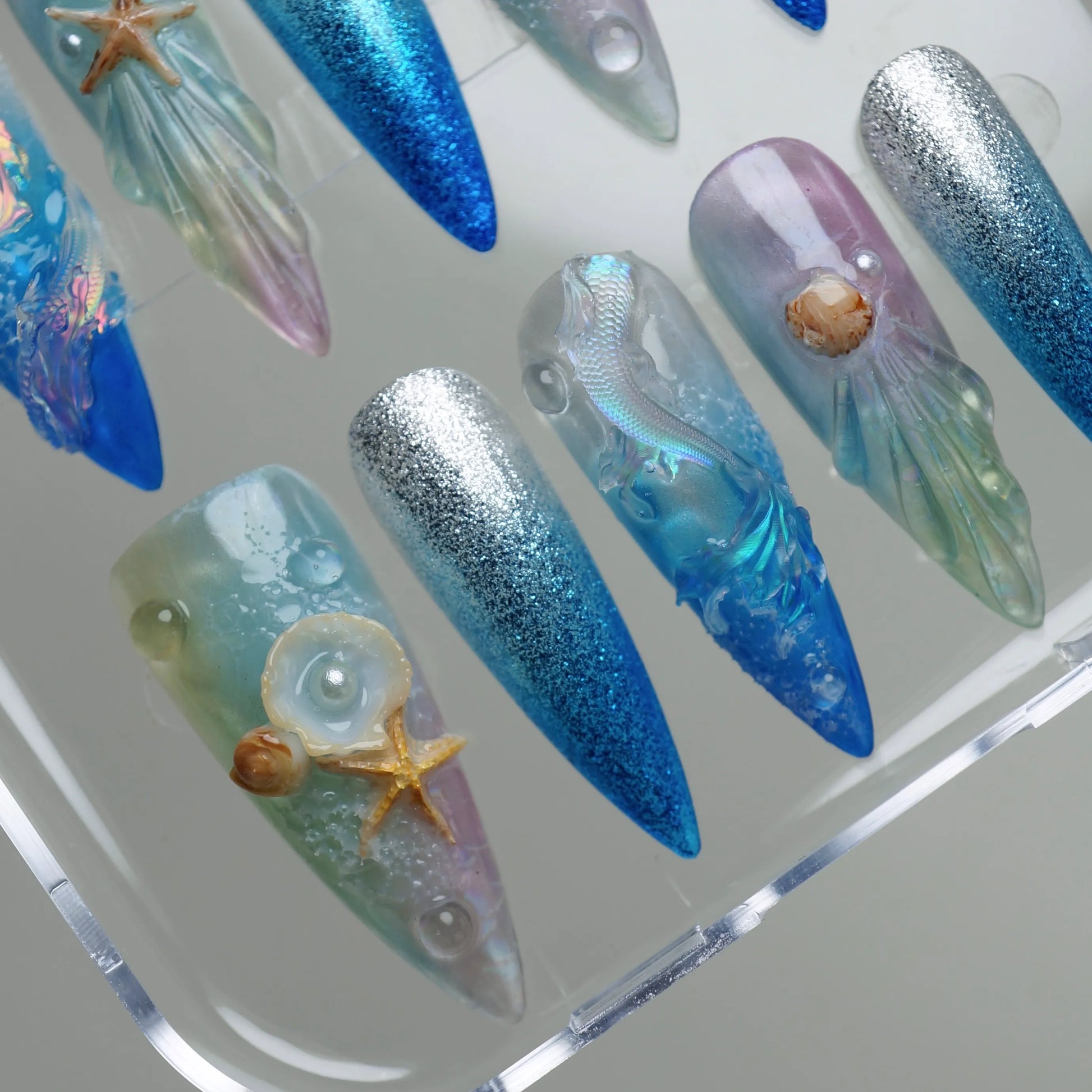 Aqualume nail art detail view featuring underwater shimmer gradient and delicate glossy sea element designs – Donailsart