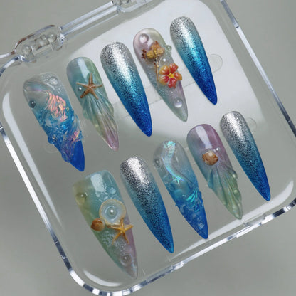 Aqualume press-on nails on display showing the full iridescent ocean depth nail art collection – Donailsart