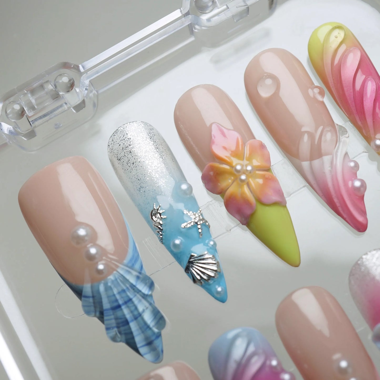 Lushwave press-on nail set product view with vibrant tropical gradient, shell, and floral summer nail art by Donailsart