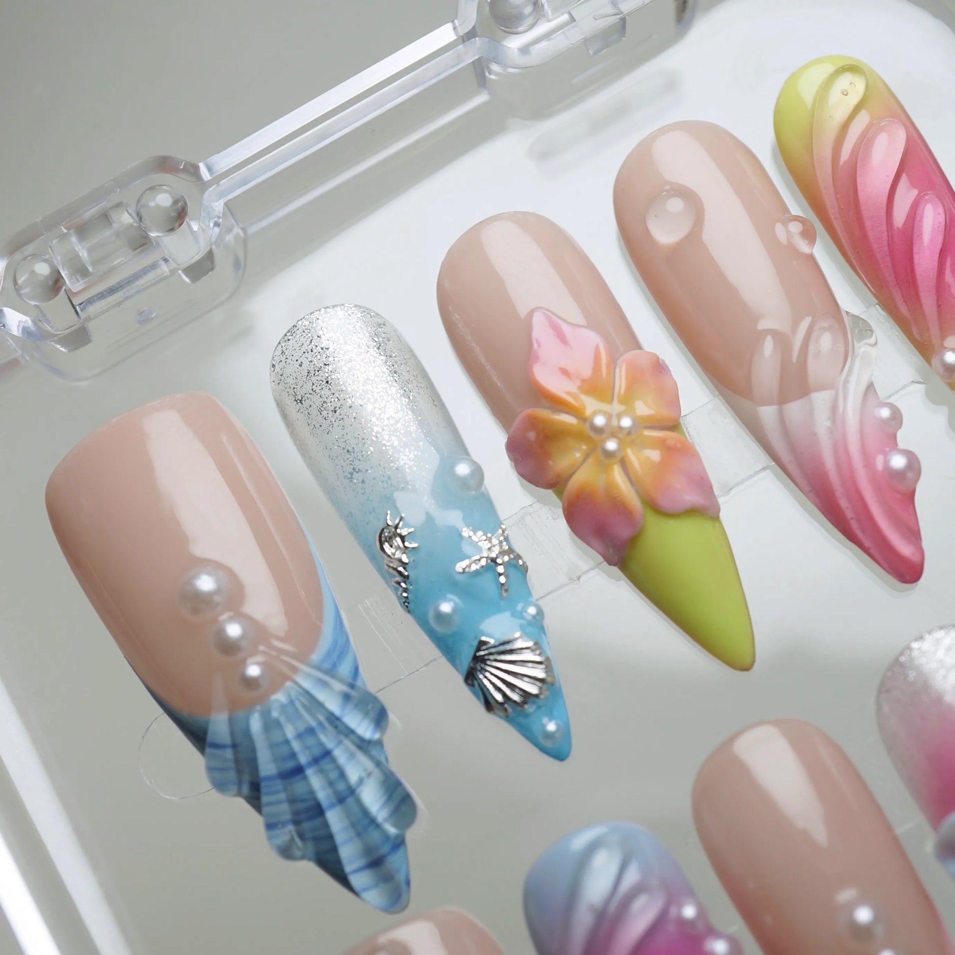 Lushwave press-on nail set product view with vibrant tropical gradient, shell, and floral summer nail art by Donailsart