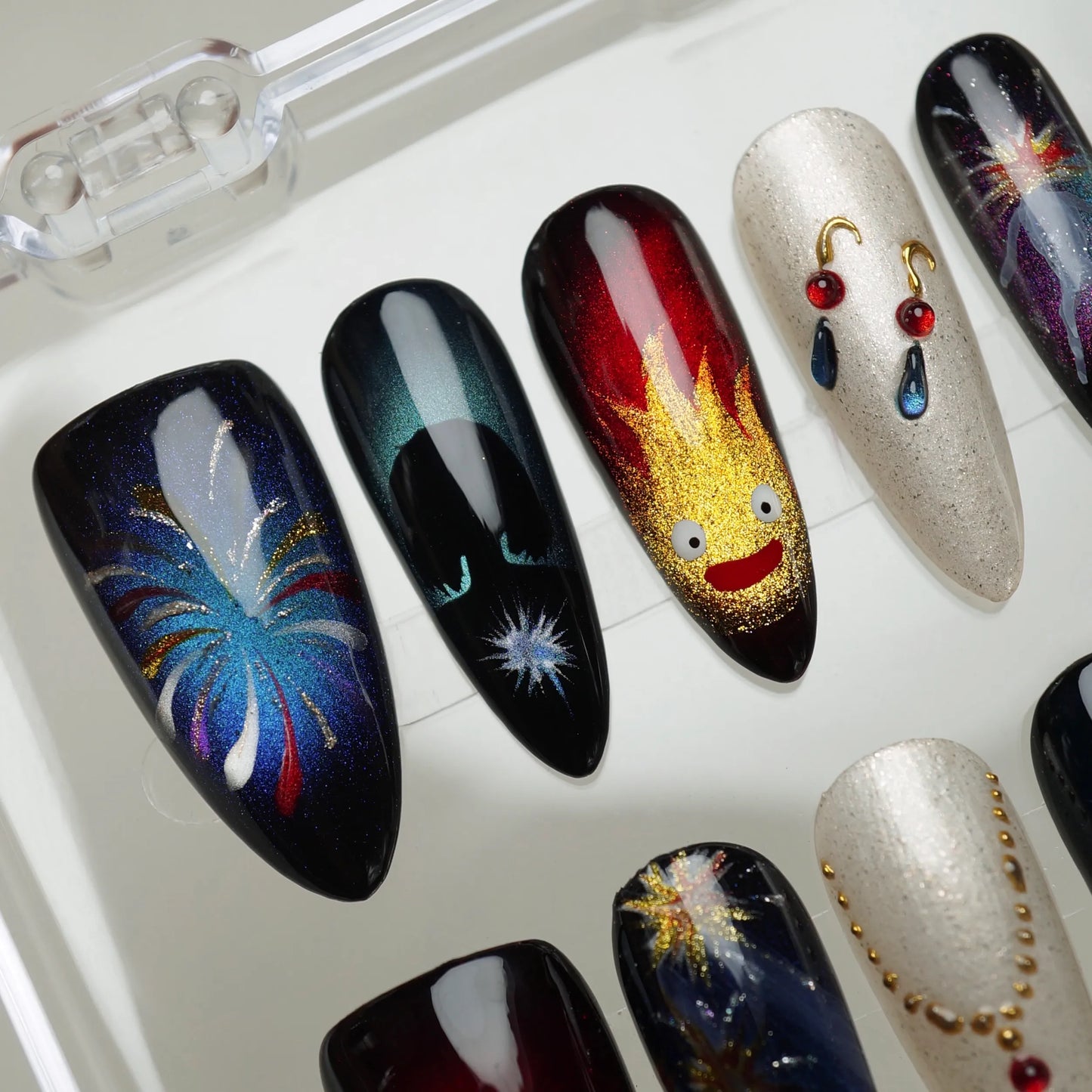 Howl's Moving Castle close-up detail showing intricate castle and magical fire nail art designs – Donailsart