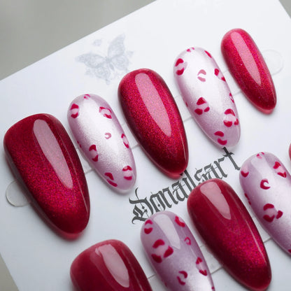 B8 | Sugar Kisses close-up detail showing glossy red shimmer with subtle leopard print accents on soft pink nails – Donailsart