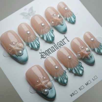 B2 | Ocean Pearl press-on nails on display showing the full ocean pearl nail art collection – Donailsart