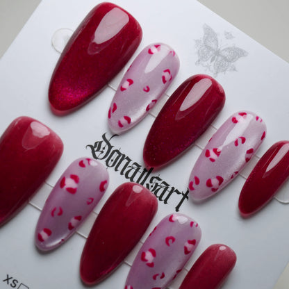 B8 | Sugar Kisses press-on nail set product view with bold crimson red shimmer and leopard accent nail art by Donailsart