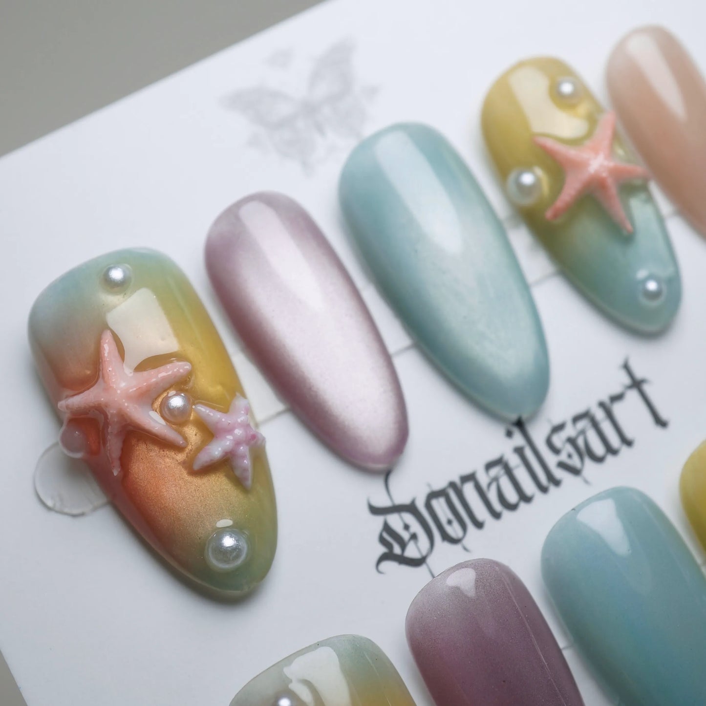 B3 | Pastel Sunset nail art detail view featuring pearl shimmer and glossy summer sky gradient nail design – Donailsart
