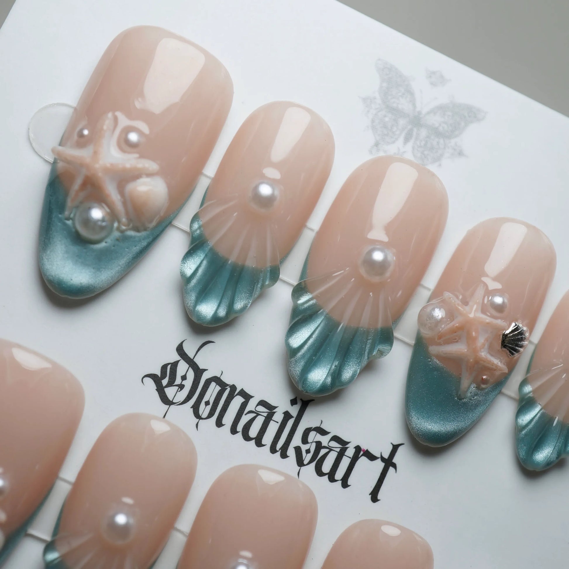 B2 | Ocean Pearl close-up detail showing sculpted seashell texture and pearl accents on nude to ocean blue gradient nails – Donailsart
