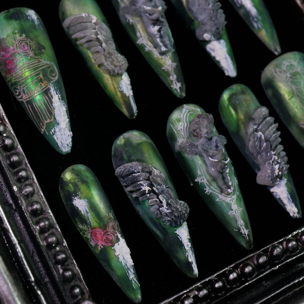 Hanging Garden press-on nails, angled close-up of green floral and vine details