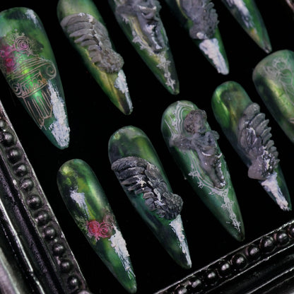 Hanging Garden press-on nails, angled close-up of green floral and vine details
