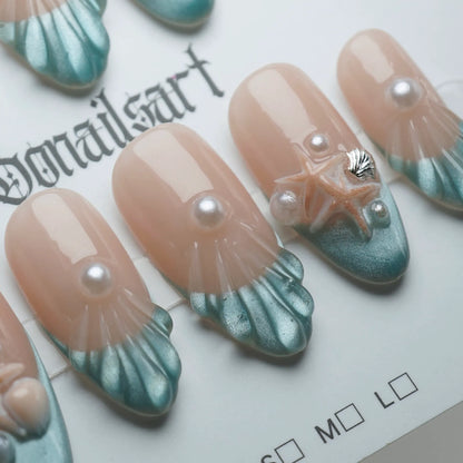 B2 | Ocean Pearl press-on nail set product view with elegant ocean-inspired nude blue shell and pearl nail art by Donailsart