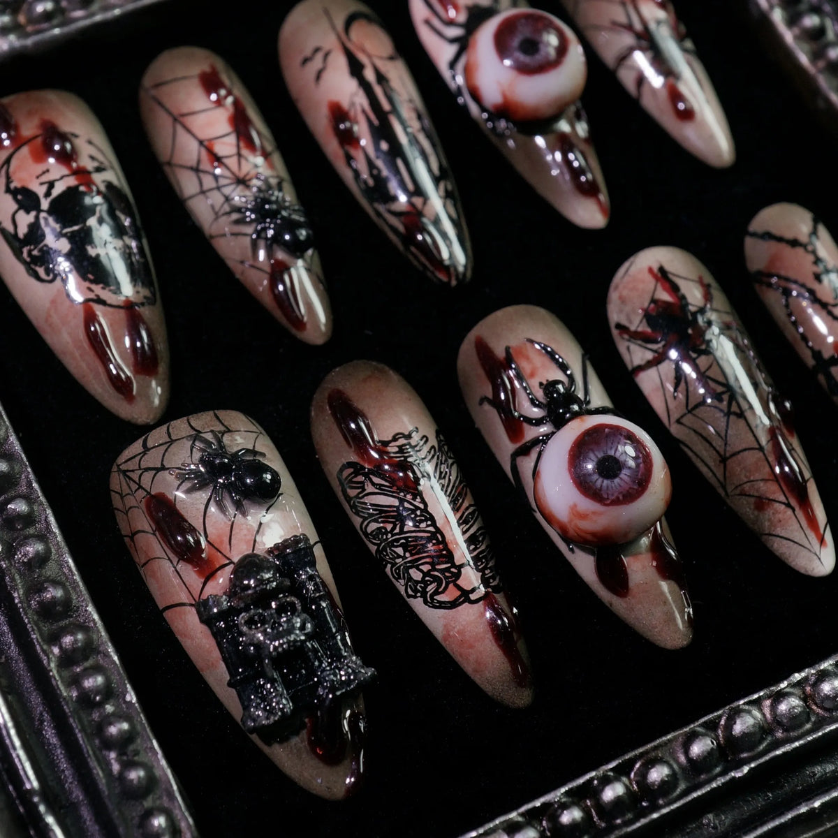Creeping Gaze press-on nails, close-up of 3D eyeballs and skulls