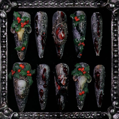 Baphomet x Christmas press-on nails: black stone-textured nails with occult goat skulls and red-green holiday details