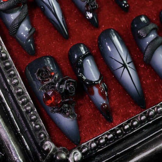 Dark Romance press-on nails, angled close-up of dark crosses and skulls