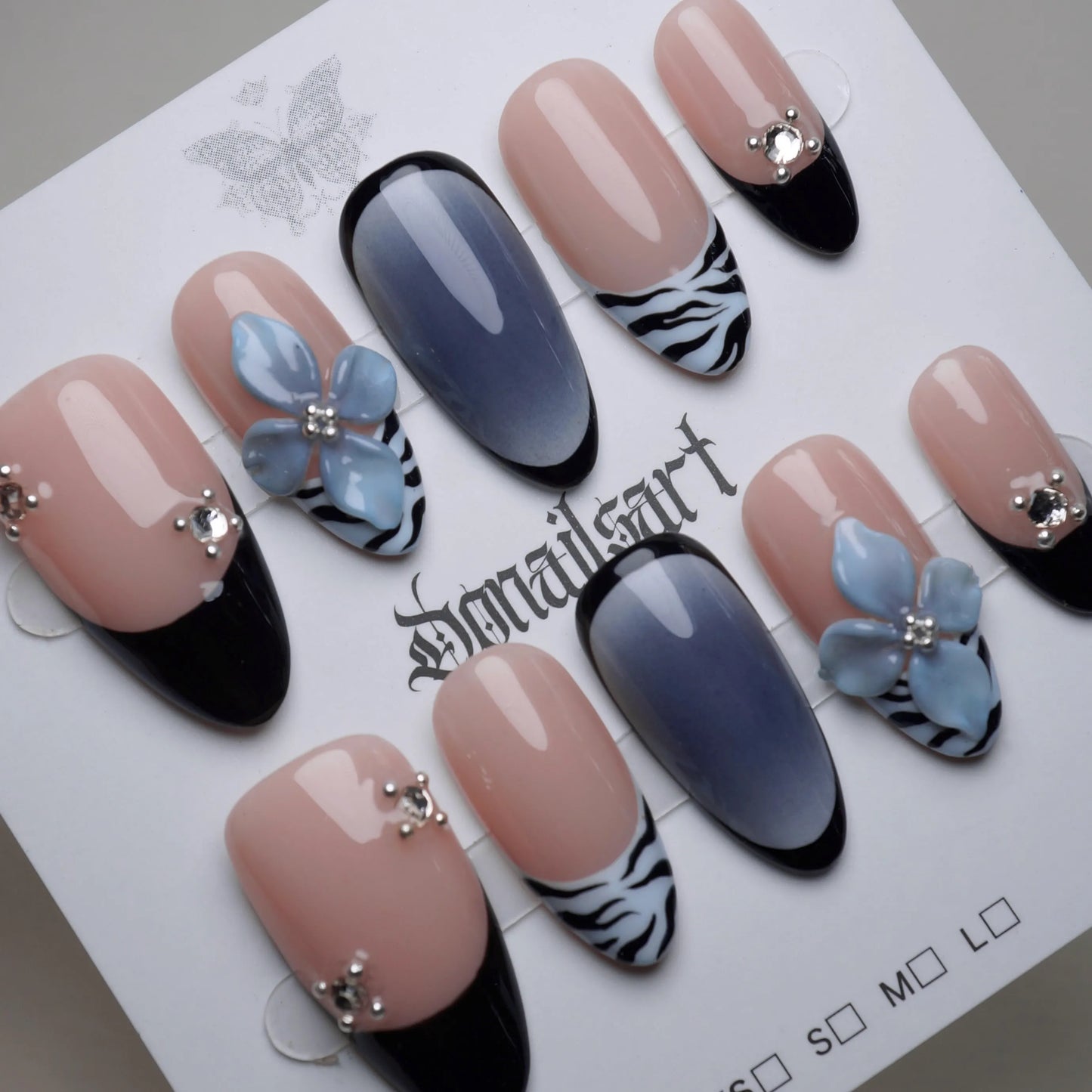 B1 | Velour Static nail art detail view featuring glossy black tips and sculpted florals on blue safari press-on nails – Donailsart