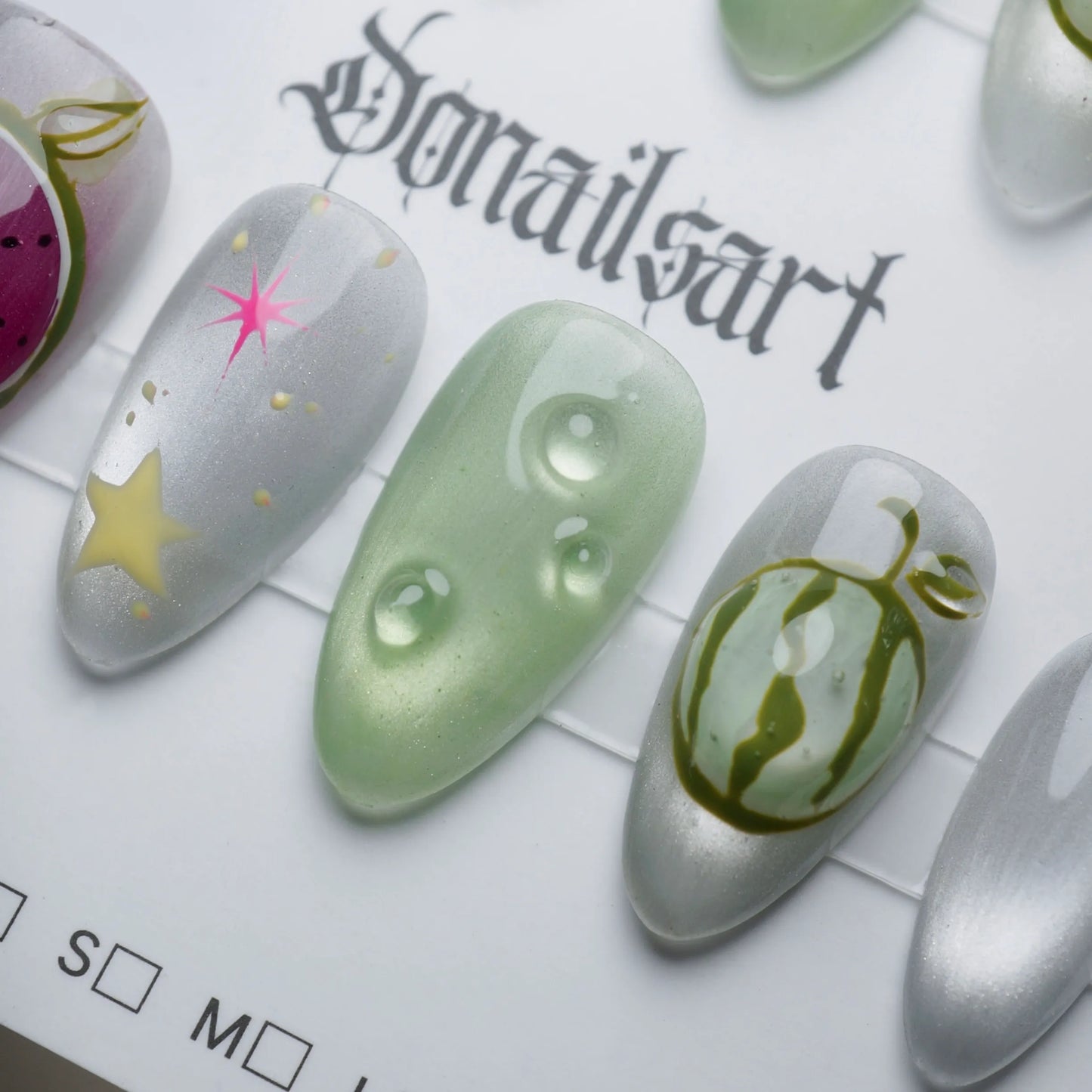 A26 | Melon Mirage nail art detail view featuring translucent green and chrome reflective surreal fruit nail designs – Donailsart