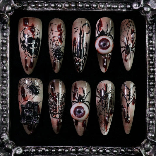 Creeping Gaze press-on nails: brown and black nails with skulls, barbed wire, spider webs and 3D eyeballs