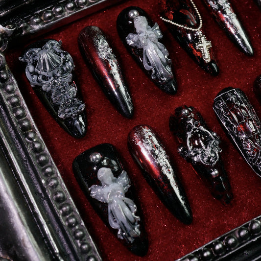 Gothic Chapel press-on nails, angled close-up of 3D angels and crosses