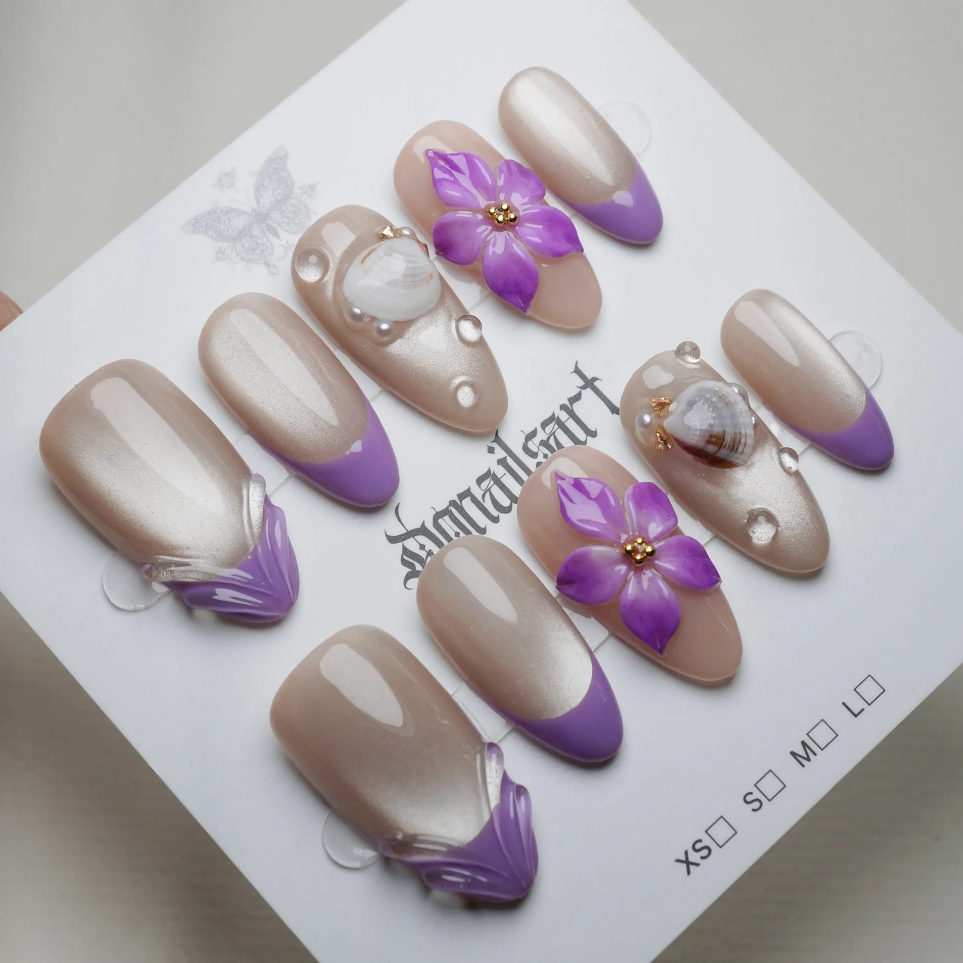A28 | Violet Shore press-on nails on display showing the full lilac pearl gradient nail art collection – Donailsart