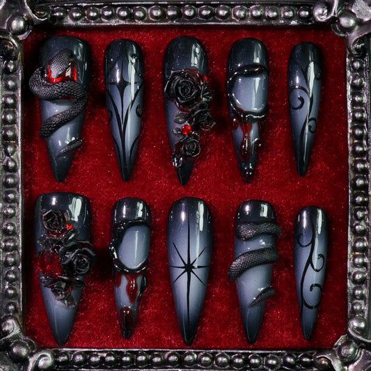 Dark Romance press-on nails: black and grey nails with dark crosses, skulls and red details