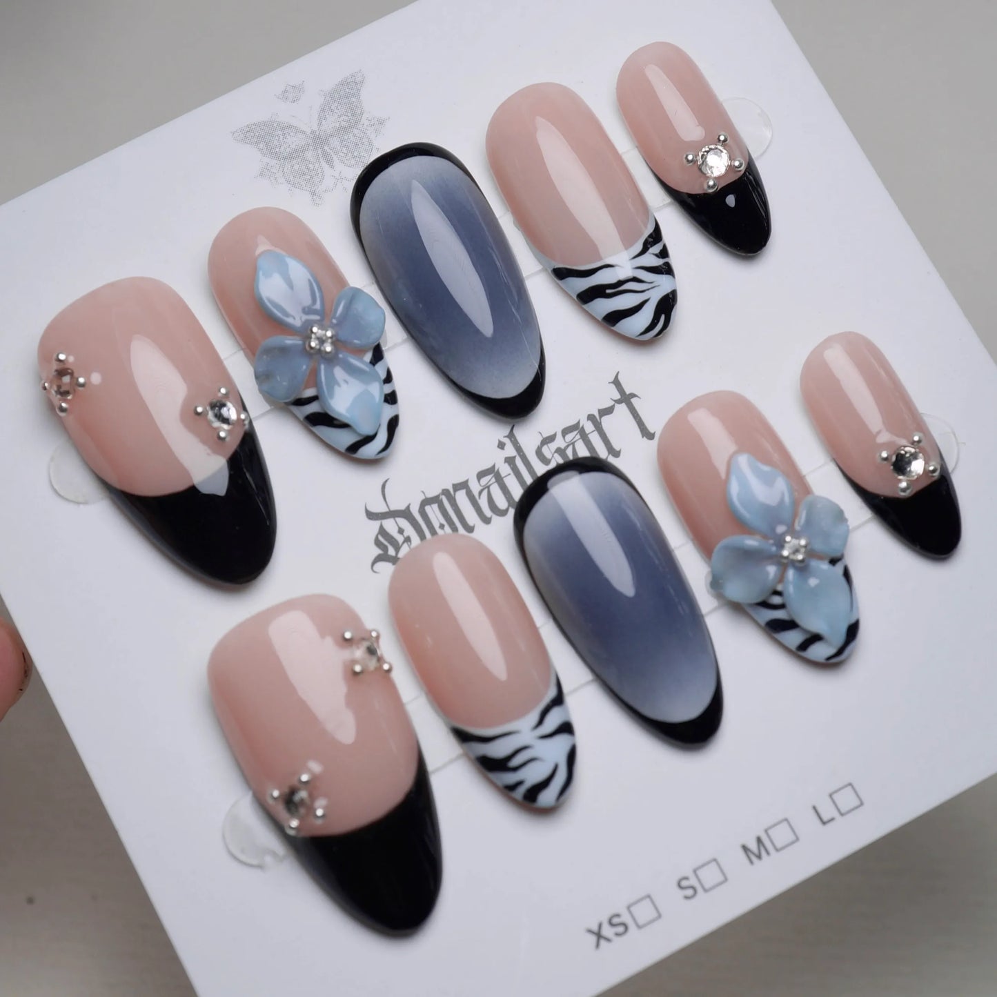B1 | Velour Static press-on nail set product view with elegant nude blue and zebra floral nail art by Donailsart