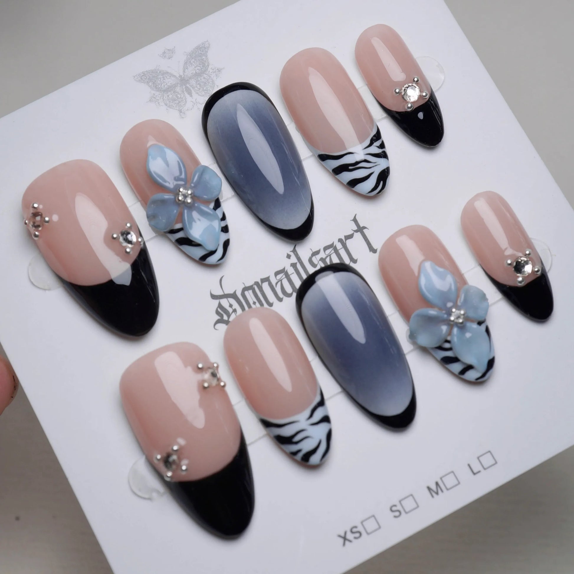 B1 | Velour Static press-on nail set product view with elegant nude blue and zebra floral nail art by Donailsart