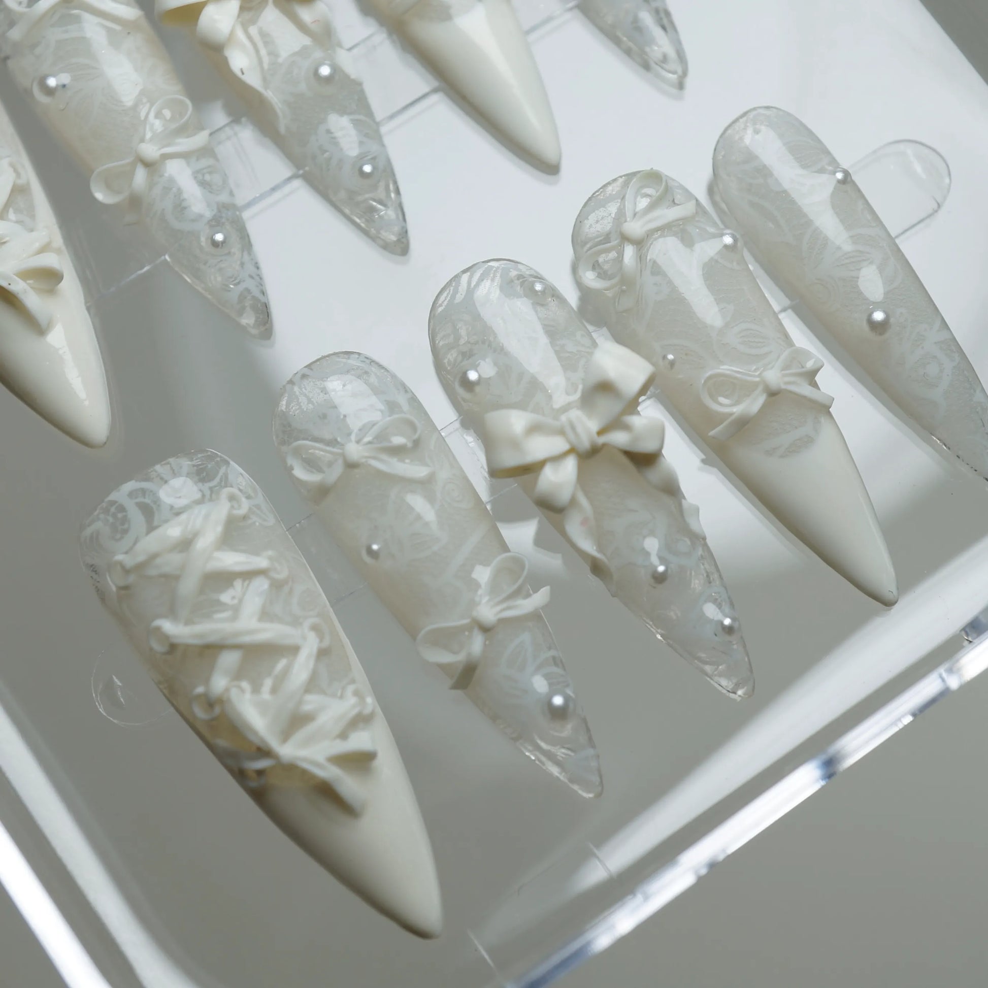 Ivory Keepsake press-on nail set product view with refined elegant lace, bow, and pearl nail art by Donailsart