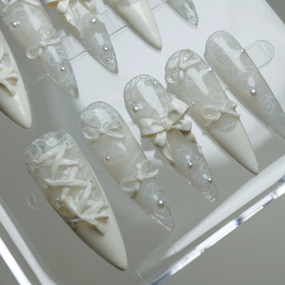 Ivory Keepsake press-on nail set product view with refined elegant lace, bow, and pearl nail art by Donailsart