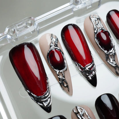 Red Alloy press-on nail set product view with bold deep red and molten chrome statement nail art by Donailsart