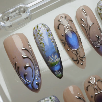 Velour Relic press-on nail set product view with preserved antique blue-violet and chrome floral nail art by Donailsart