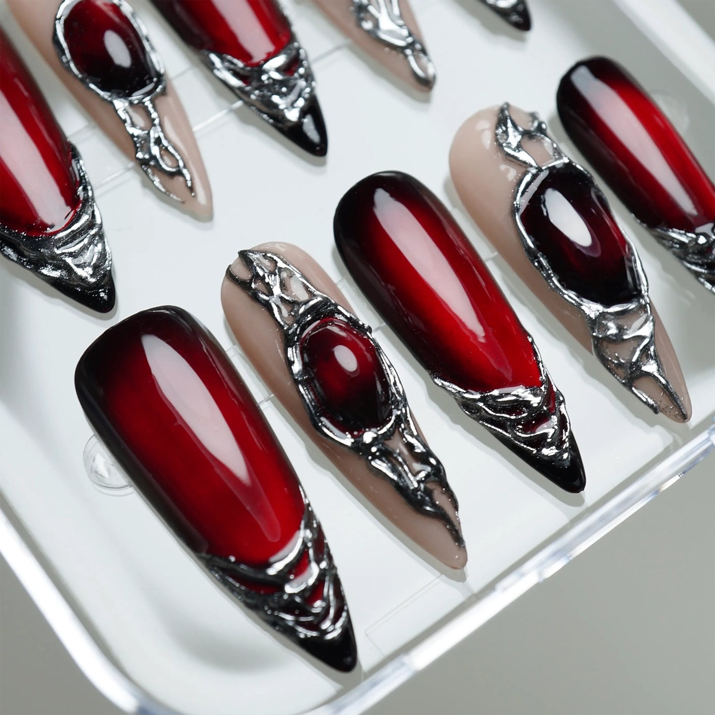 Red Alloy close-up detail showing deep red sealed under glossy glass surface with molten chrome framing – Donailsart
