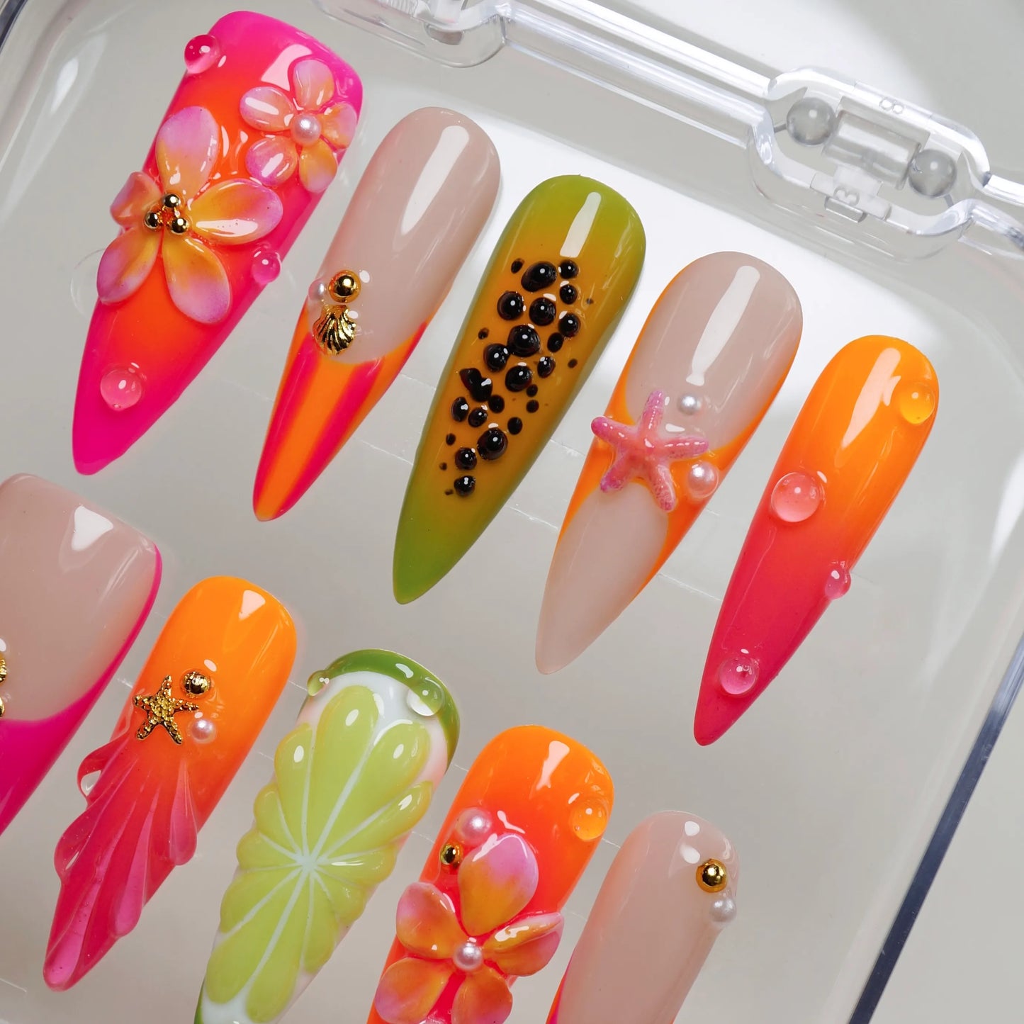 Papaya Splash press-on nail set product view with bold tropical fruit and beach nail art in papaya orange and hot pink by Donailsart