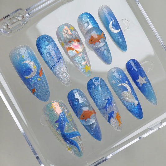 Starlit Aquarium press-on nails on display showing the full magical underwater aquarium nail art collection – Donailsart