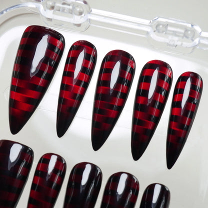 Riot Grid press-on nail set product view with high-voltage black and crimson grid nail art by Donailsart
