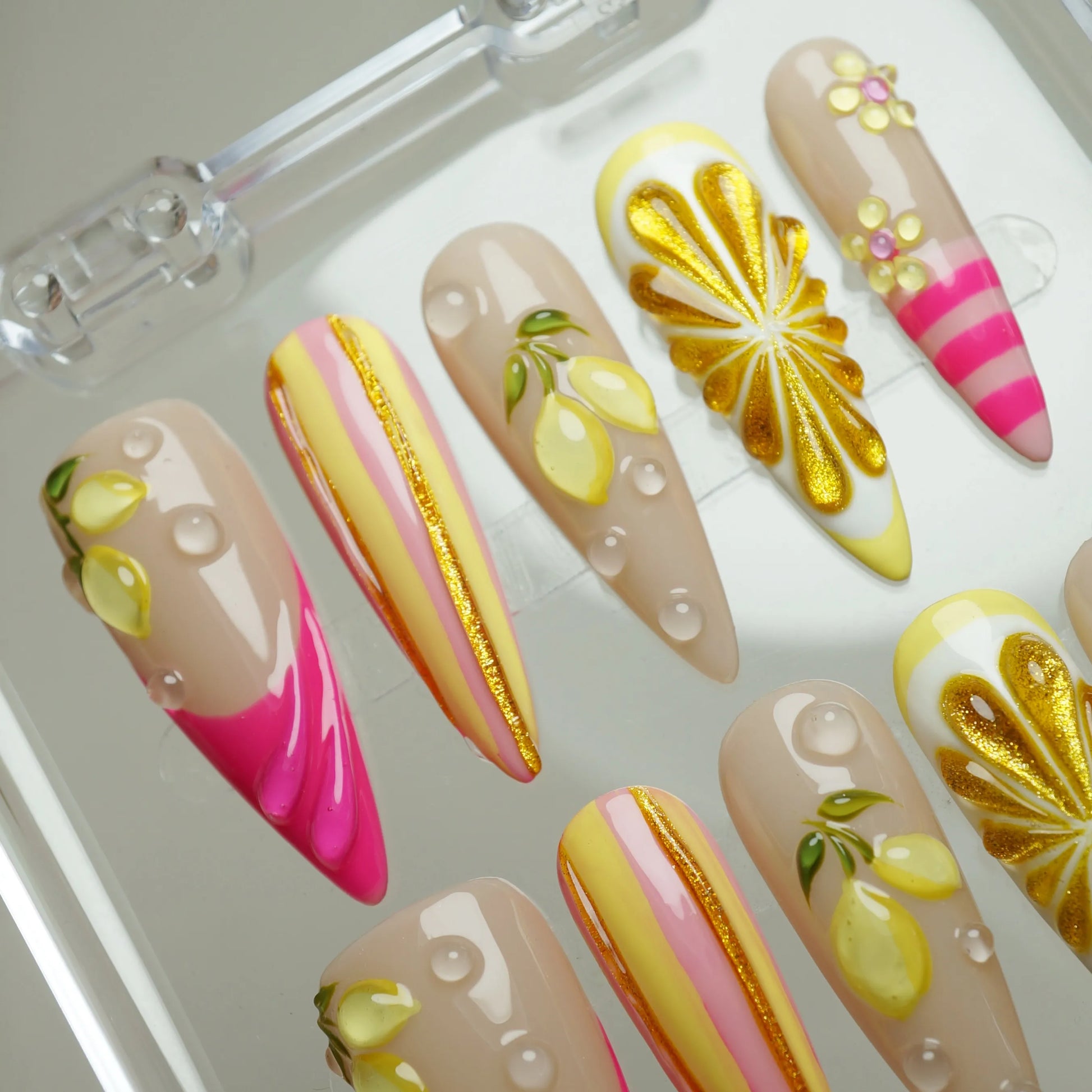 Lemon Sugar Rush press-on nail set product view with bright fruity candy summer nail art in lemon yellow and hot pink by Donailsart