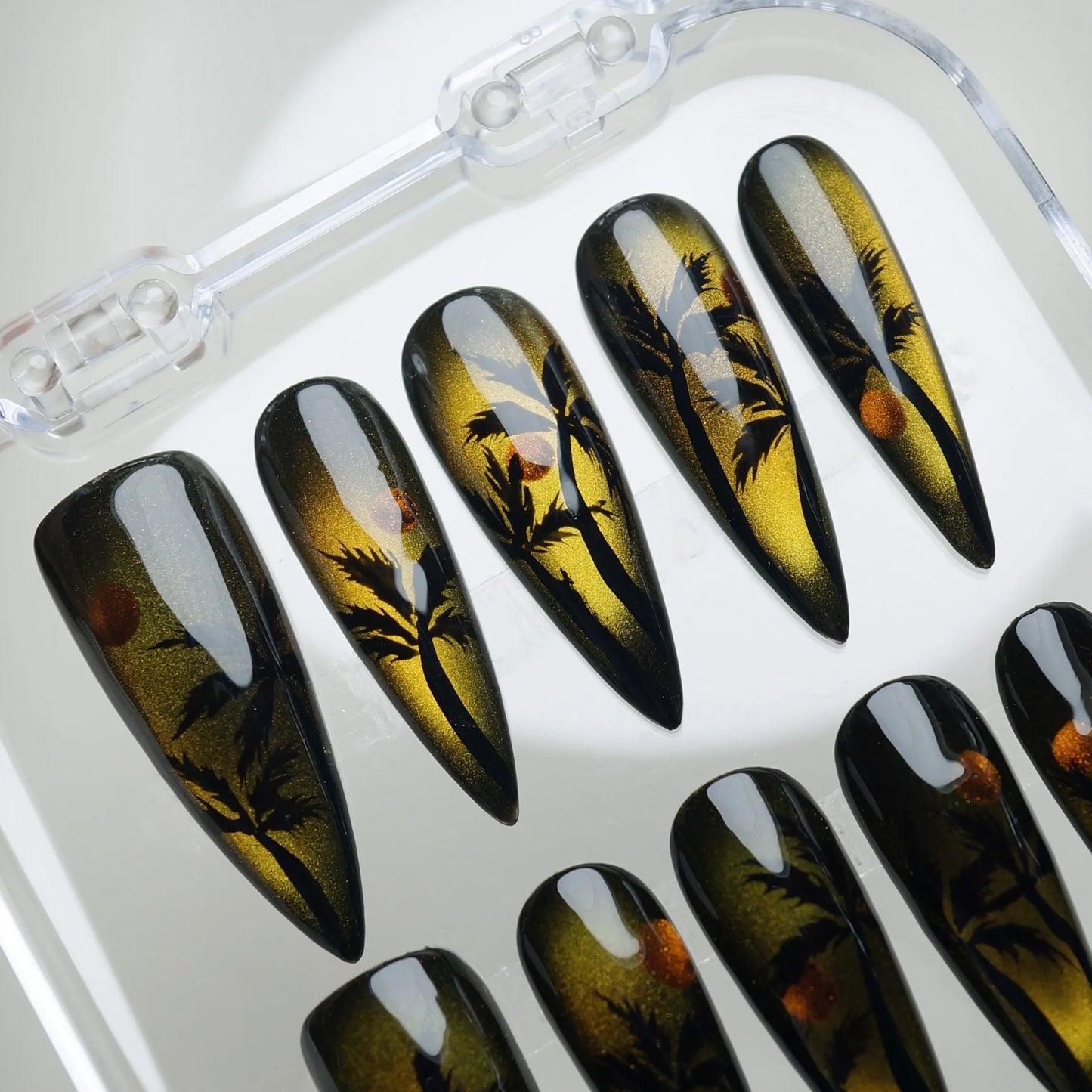 Island Sunrise press-on nail set product view with warm tropical sunrise cat-eye and beach silhouette nail art by Donailsart