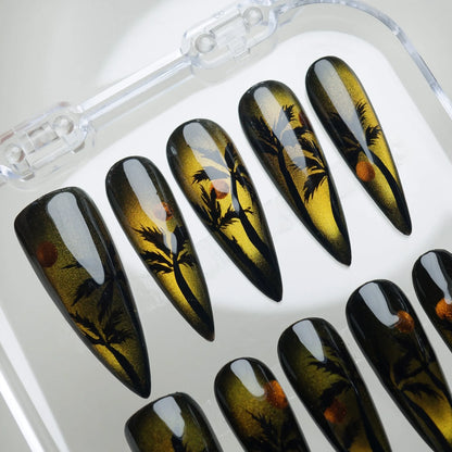 Island Sunrise press-on nail set product view with warm tropical sunrise cat-eye and beach silhouette nail art by Donailsart