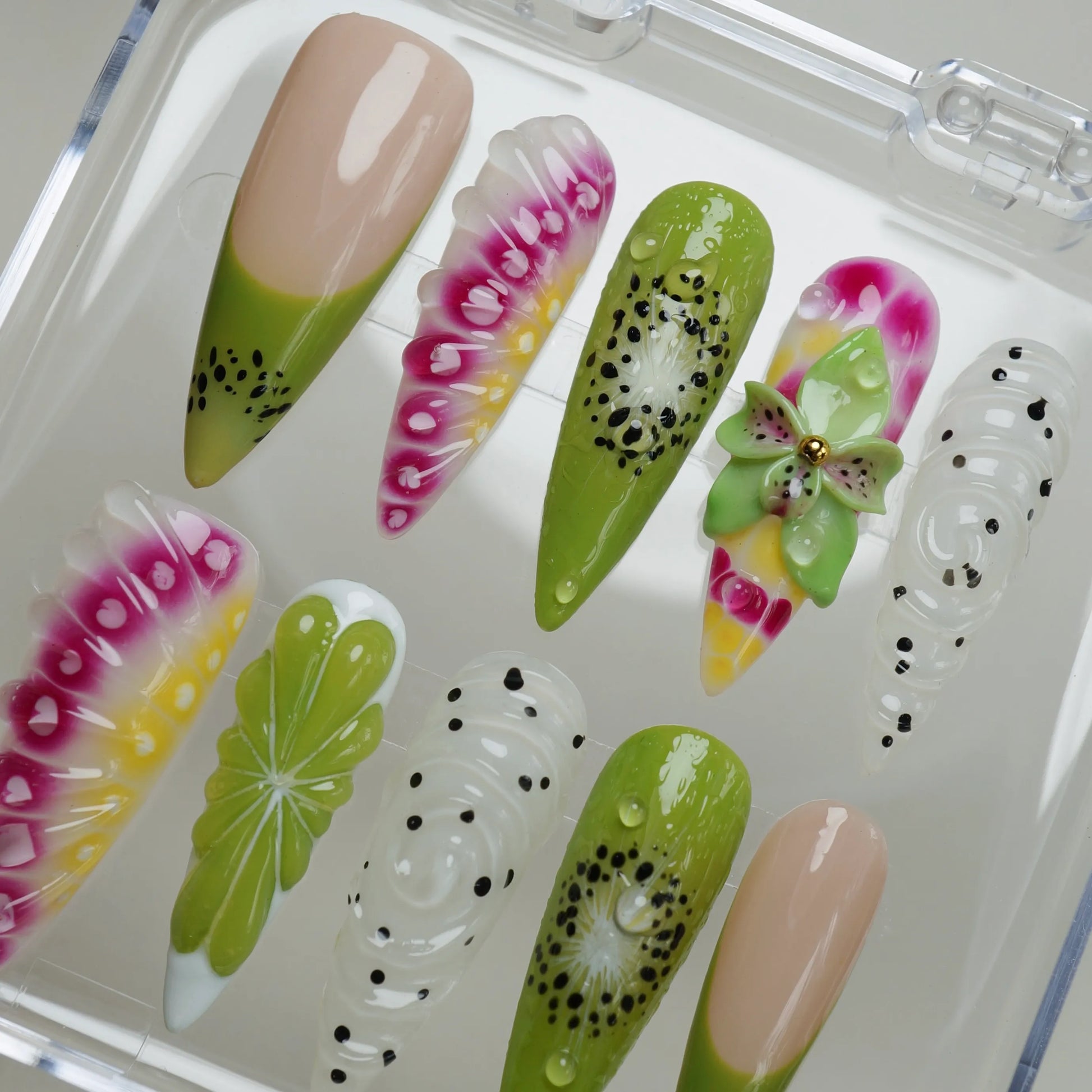Fruit Static press-on nail set product view with bold tropical jelly nail art in citrus yellow, kiwi green, and dragon fruit pink by Donailsart