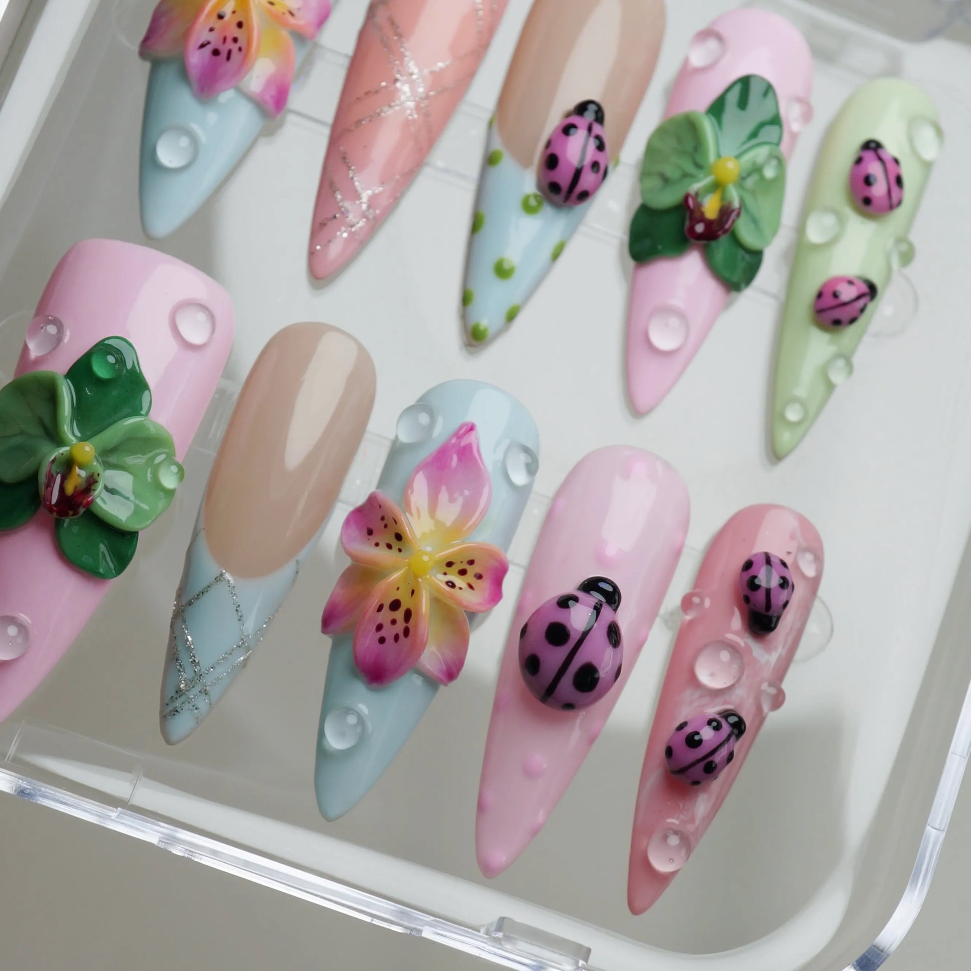 Ladybug Lagoon close-up detail showing 3D ladybug accents, glossy water droplet effects, and soft pastel flower designs – Donailsart